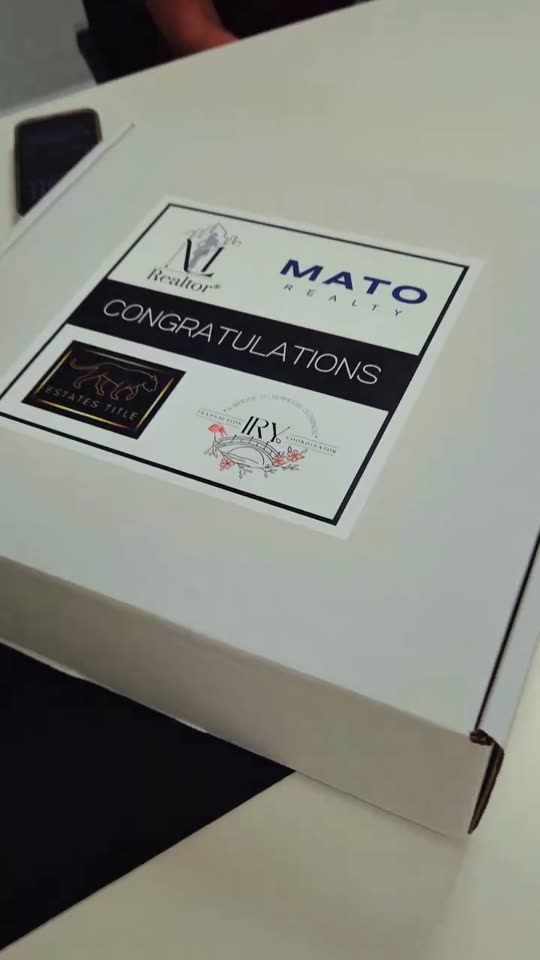 Closing-day gift box from Mily Lopez and Mato Realty