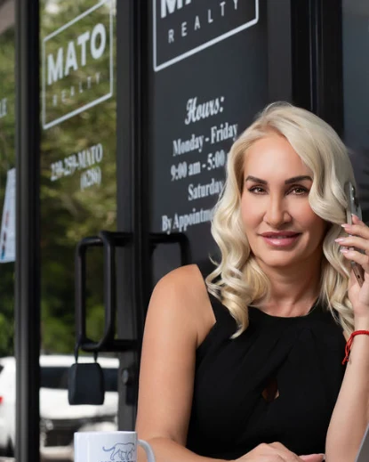 Mily Lopez working outside the Mato Realty office
